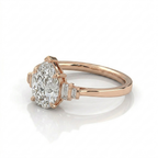 Pear Cut Diamond Engagement Ring in Solid Gold with Baguette Side Stones