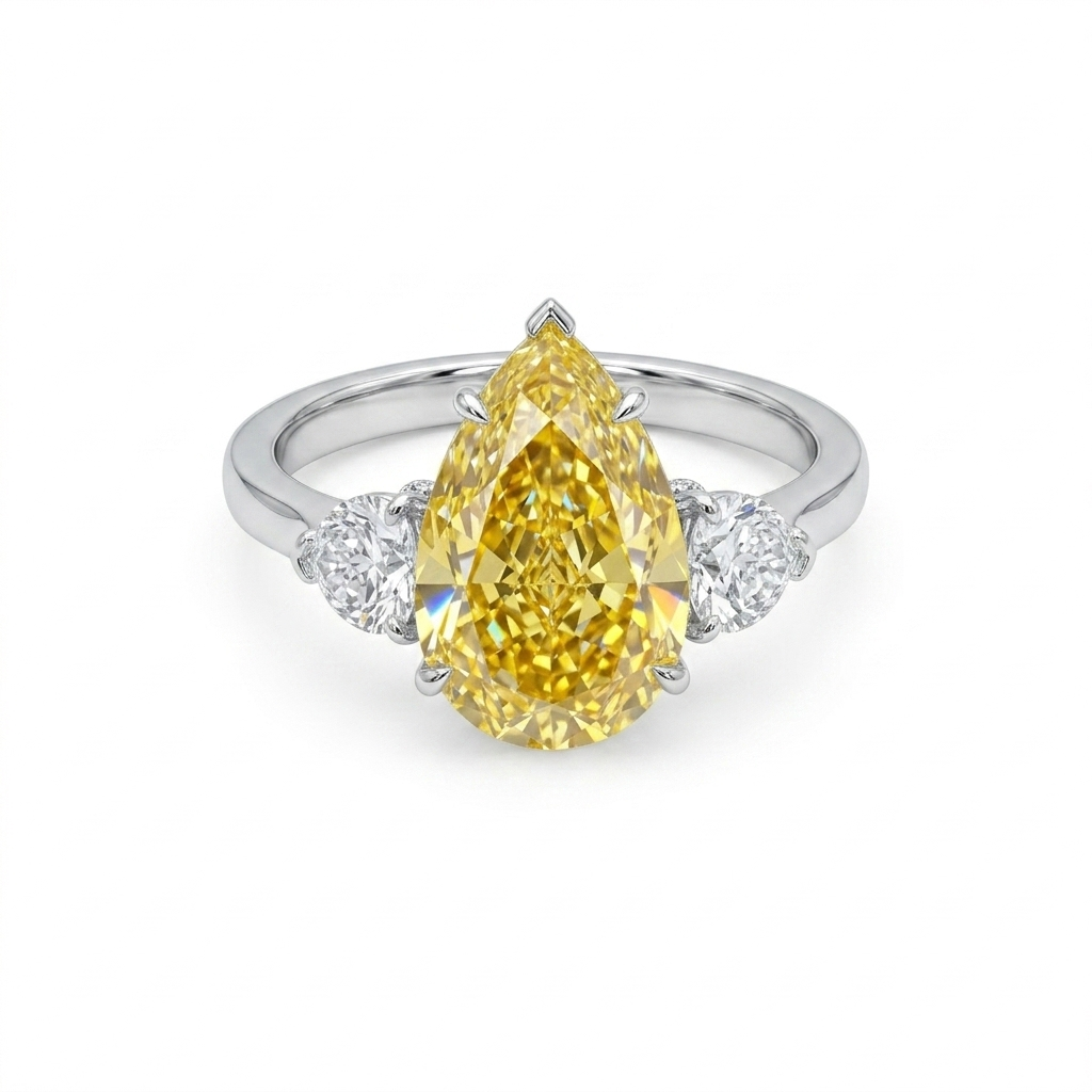 Fancy Yellow Pear Cut Diamond Engagement Ring in 18K Gold | Three Stone Yellow Diamond Ring