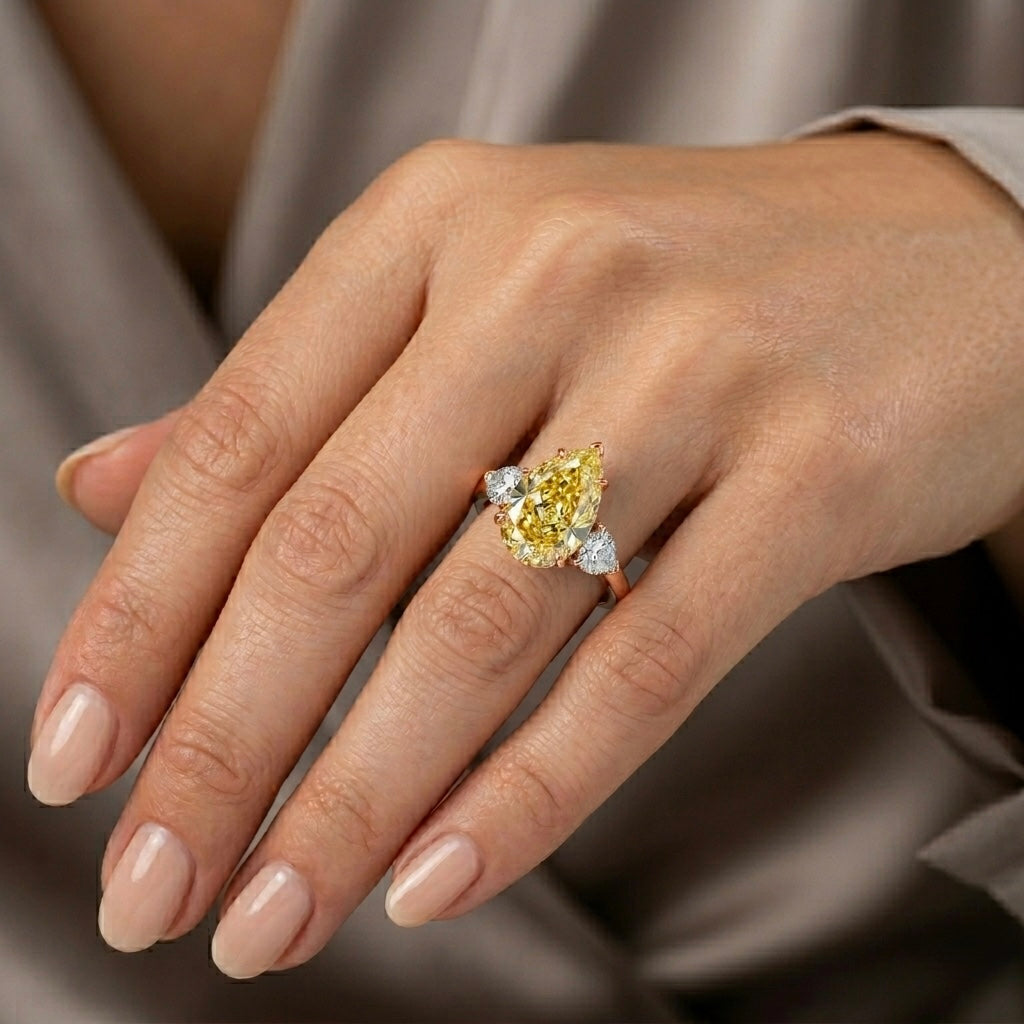 Fancy Yellow Pear Cut Diamond Engagement Ring in 18K Gold | Three Stone Yellow Diamond Ring