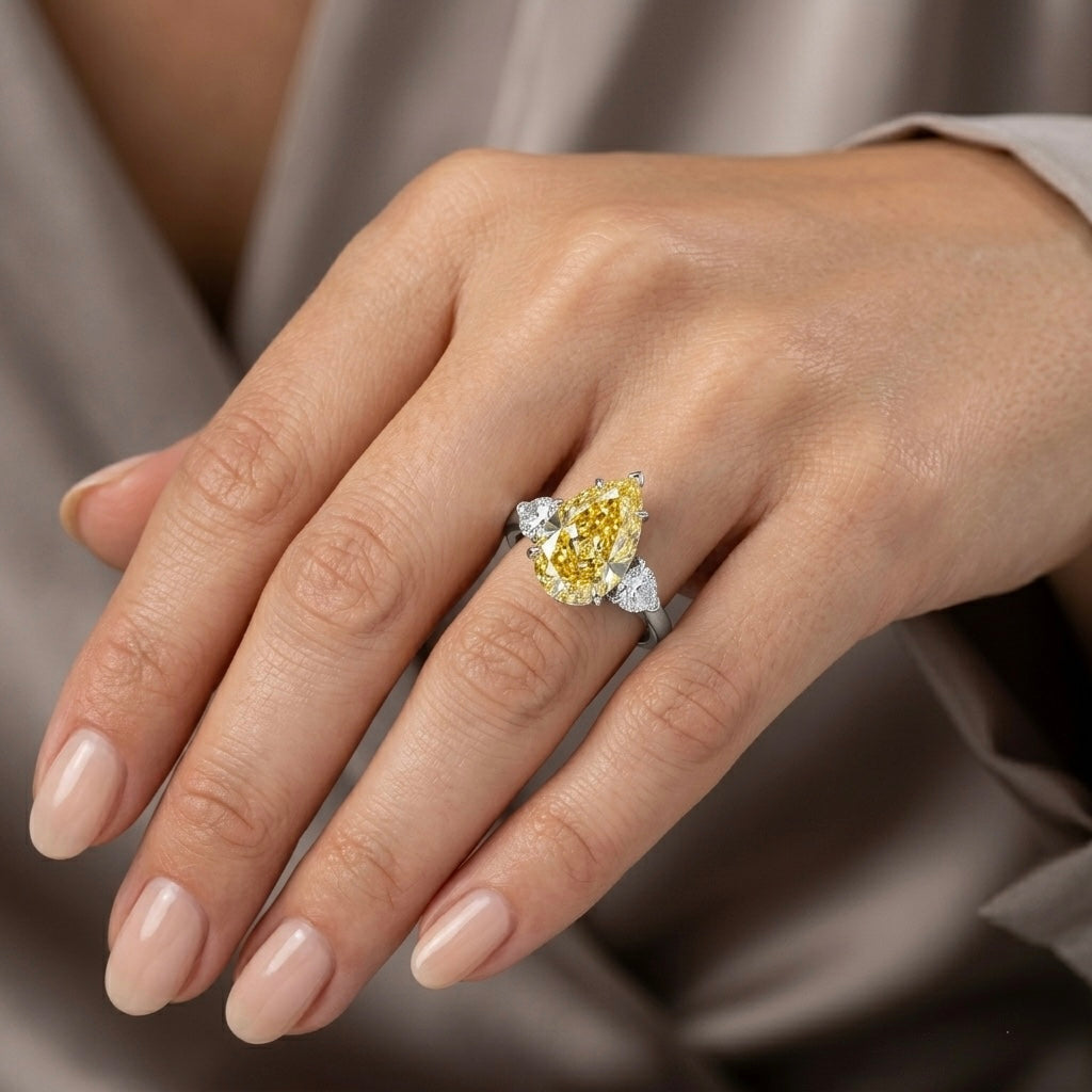 Fancy Yellow Pear Cut Diamond Engagement Ring in 18K Gold | Three Stone Yellow Diamond Ring