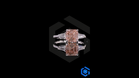 Elegance Reflected: Peach-Toned Emerald Cut Diamond Ring