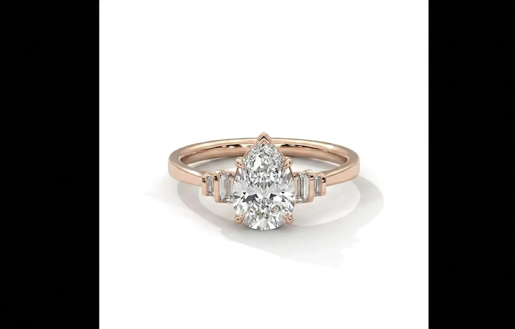 Pear Cut Diamond Engagement Ring in Solid Gold with Baguette Side Stones