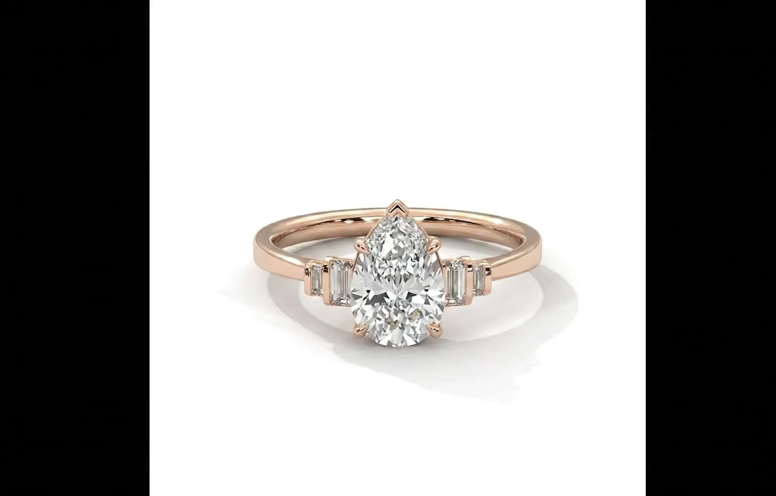 Pear Cut Diamond Engagement Ring in Solid Gold with Baguette Side Stones